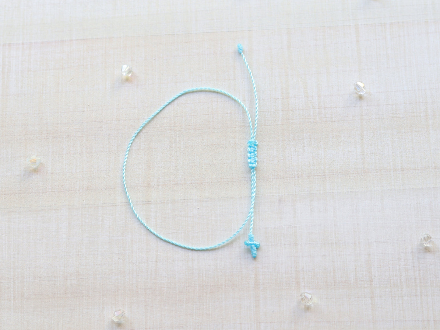 Tiny Cross Cord Bracelet